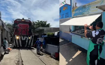 Un tren pasa en medio de este mercado de Mariscos en Mazatlán